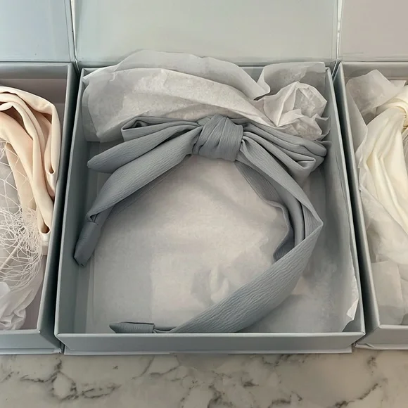 Lot of 3 New in Boxes Kristin Ess headbands. Ivory, blue and white.  You get all 21 Best Hair Bows to Turn Up the Charm On Any Look 2024 | Allure main image 3